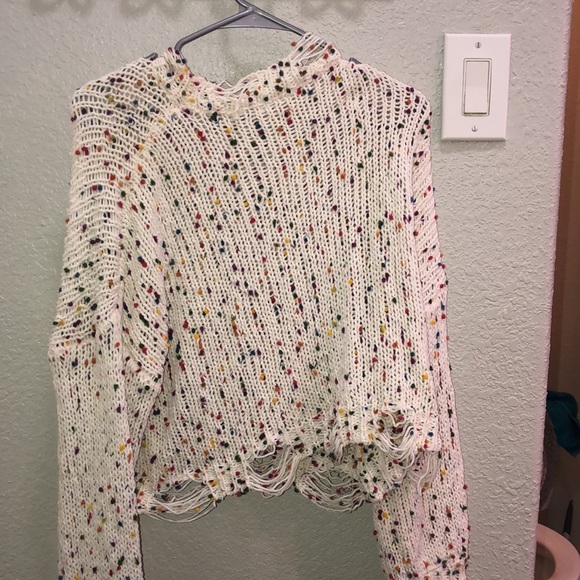 A cute colorful sweater with  a distressed bottom - Picture 5 of 6